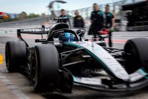 Modern Formula 1 race car showcasing advanced hybrid engine technology on a professional racing circuit.