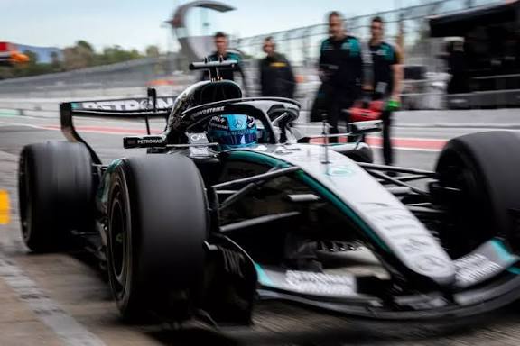 Modern Formula 1 race car showcasing advanced hybrid engine technology on a professional racing circuit.