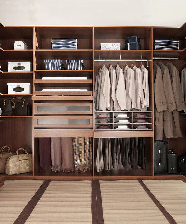 Essential clothing pieces for a men's capsule wardrobe including shirts, jeans, shoes, and accessories.
